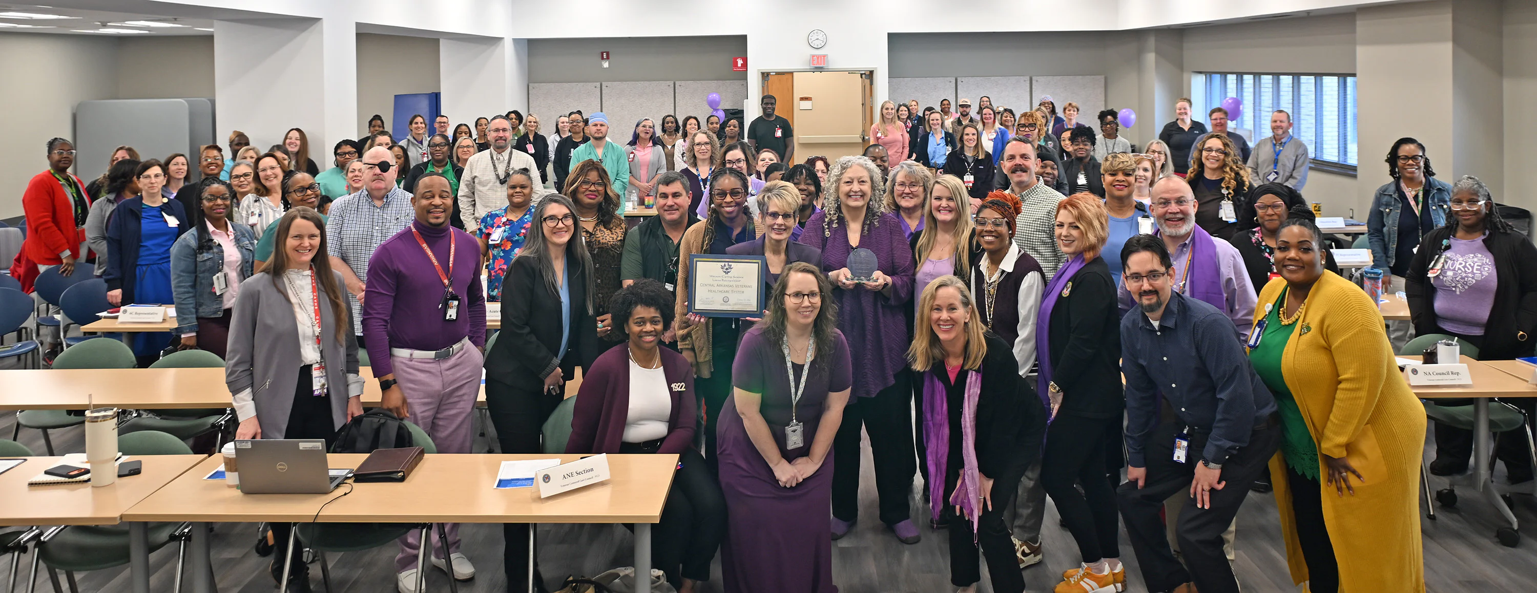 CAVHS team posing for an image with the lotus recogntiion award
